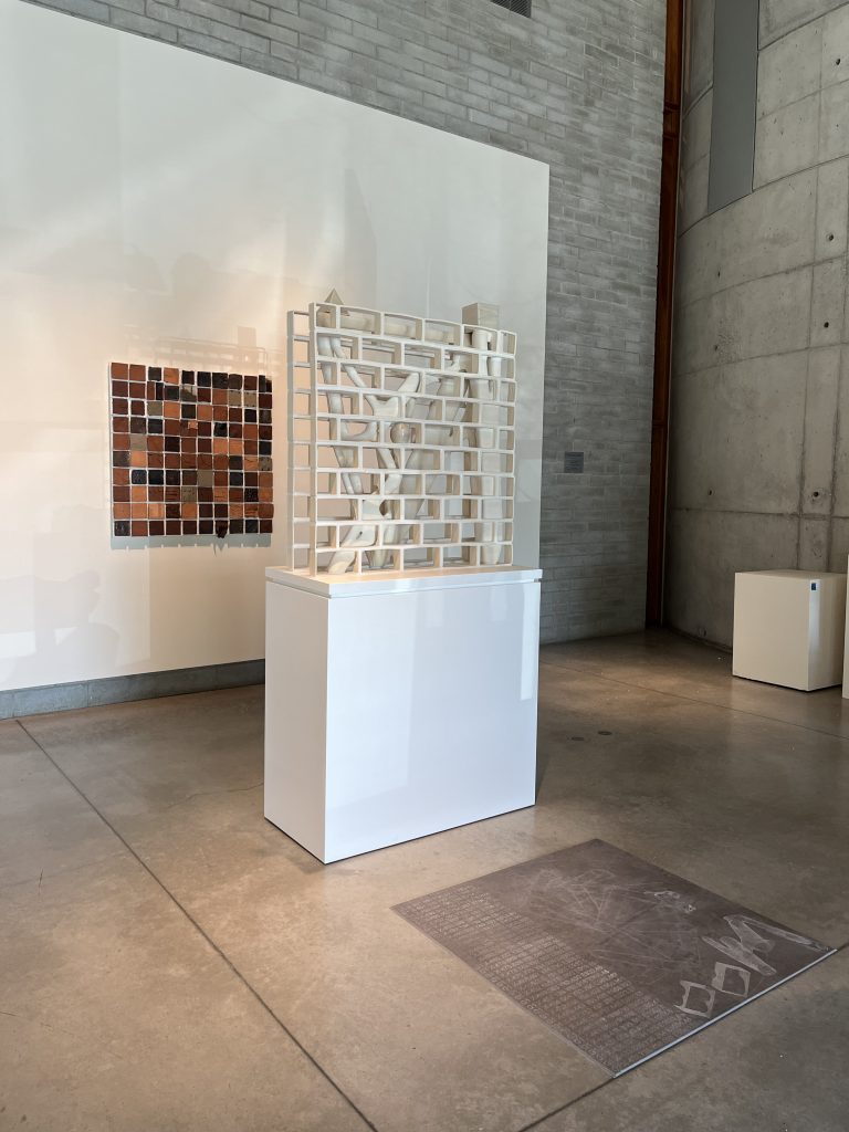 a model of a wall, on a white block