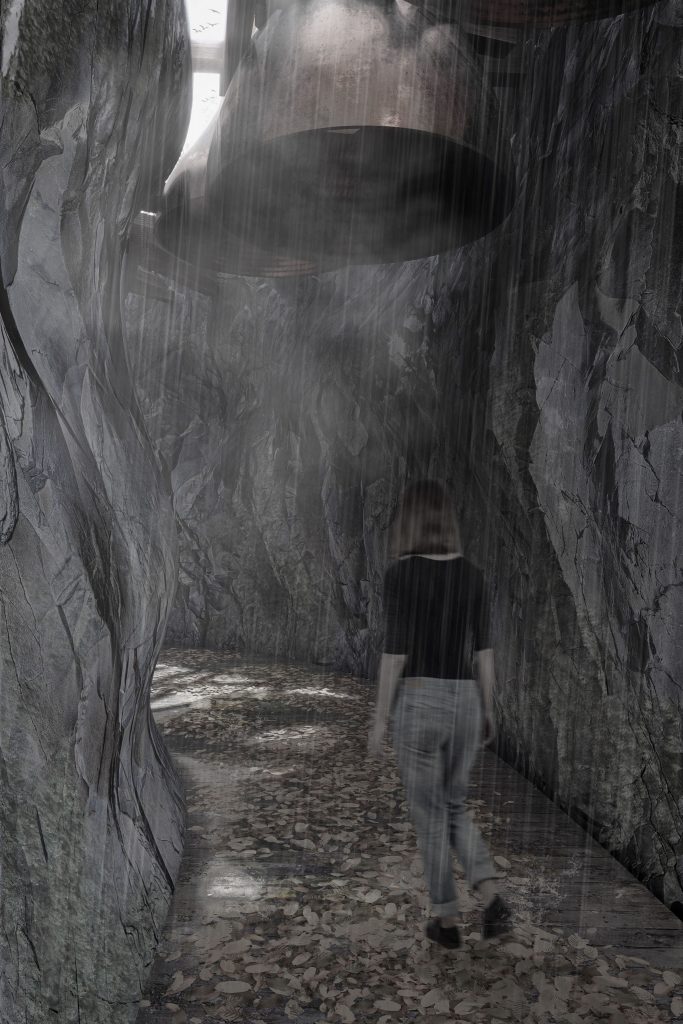 A woman walking through a cave in the rain, with a huge bell overhead.