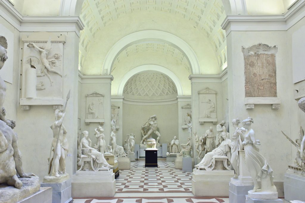 An image captured within the Museum Gipsoteca Antonio Canova, showcasing a room filled with statues