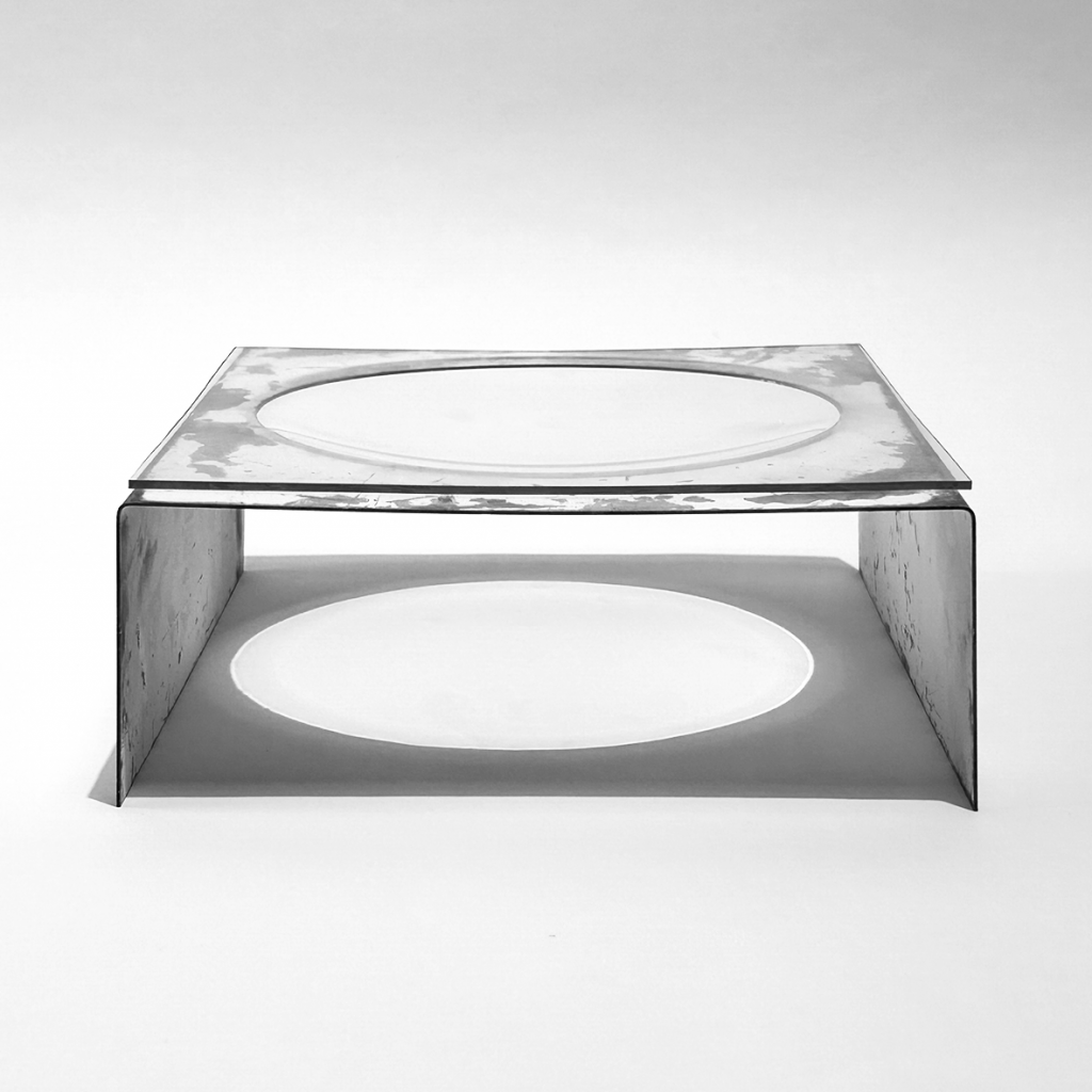 a sleek, modern glass object with an oval cutout in the center