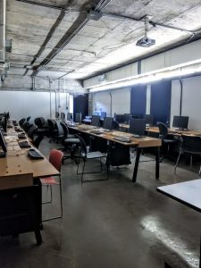 Interior view of a lab in our building - long desks and computer terminals