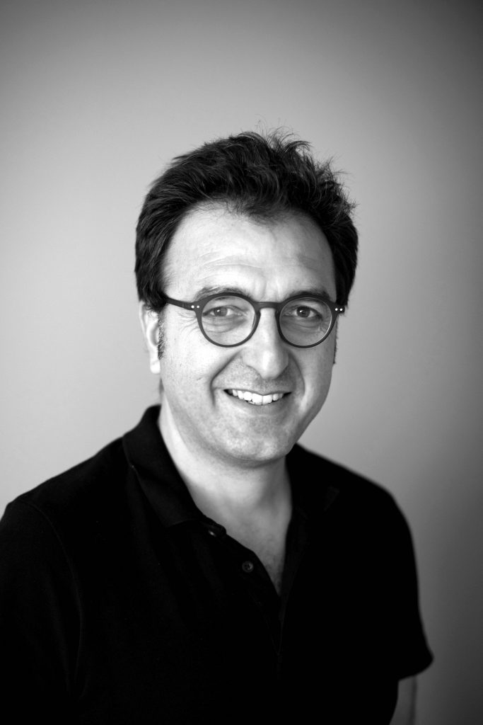 Black and white headshot of Serkan Taycan