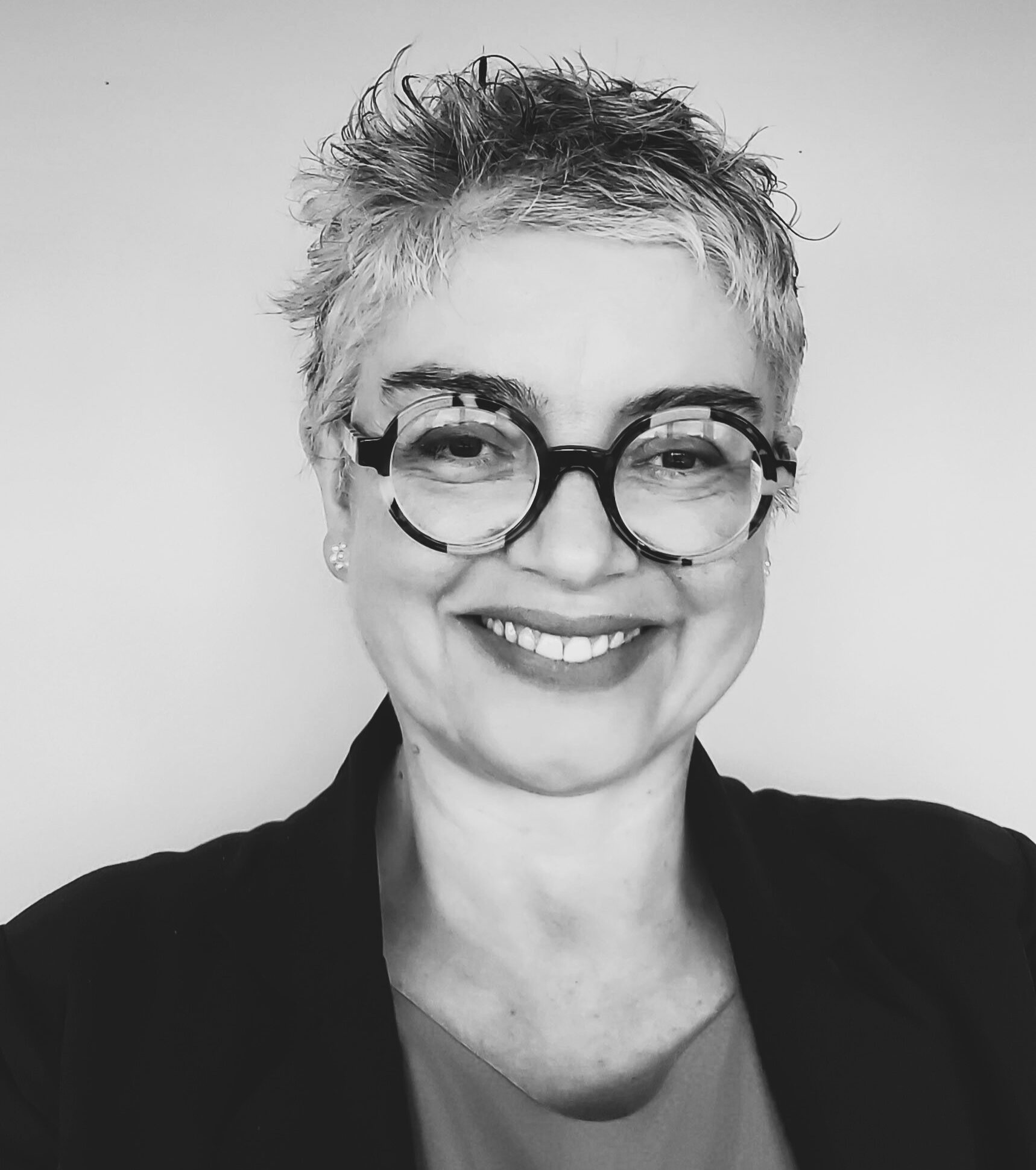 Black and white headshot of Adriana Ross