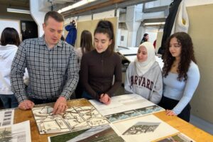 Mathieu Fleury, Cornwall's chief administrative officer, reviews student work at the Architecture Building