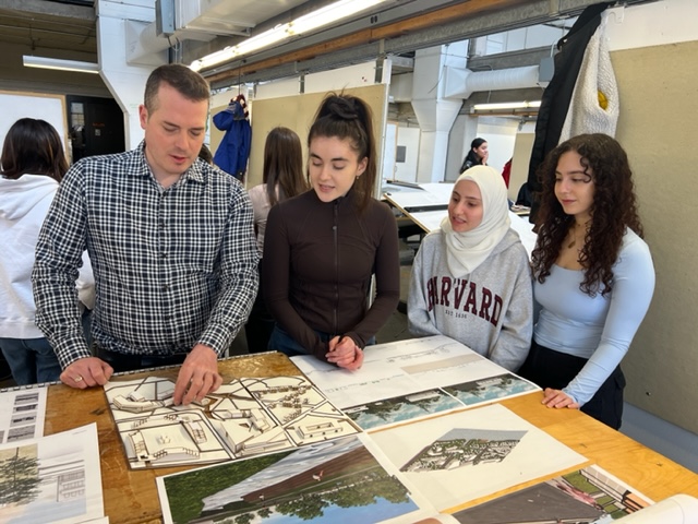 Mathieu Fleury, Cornwall's chief administrative officer, reviews student work at the Architecture Building