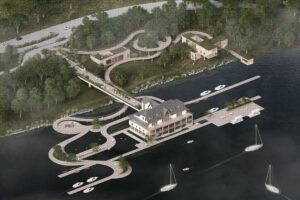 An aerial rendering of the Flow project with pathways, buildings, and a dock integrated into a forested landscape.