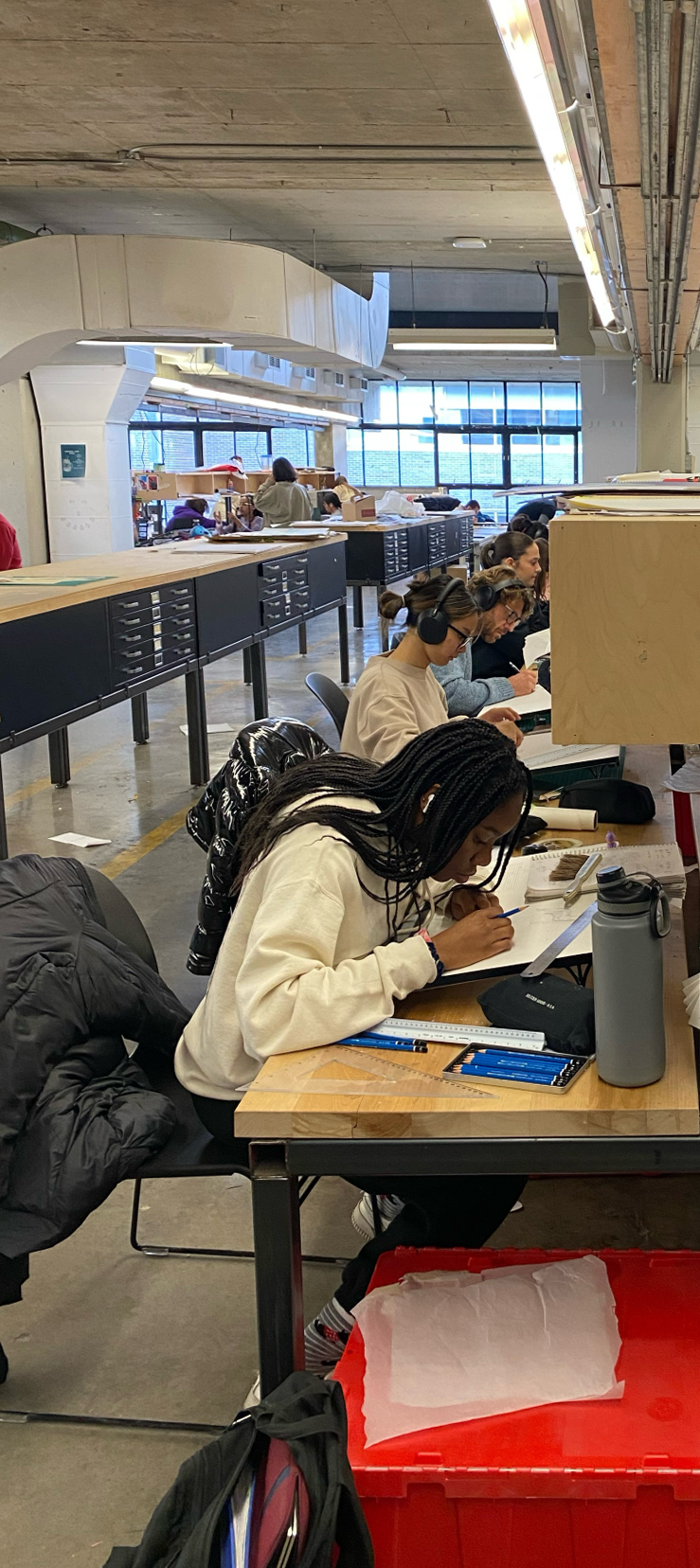 Students in architecture studio drawing
