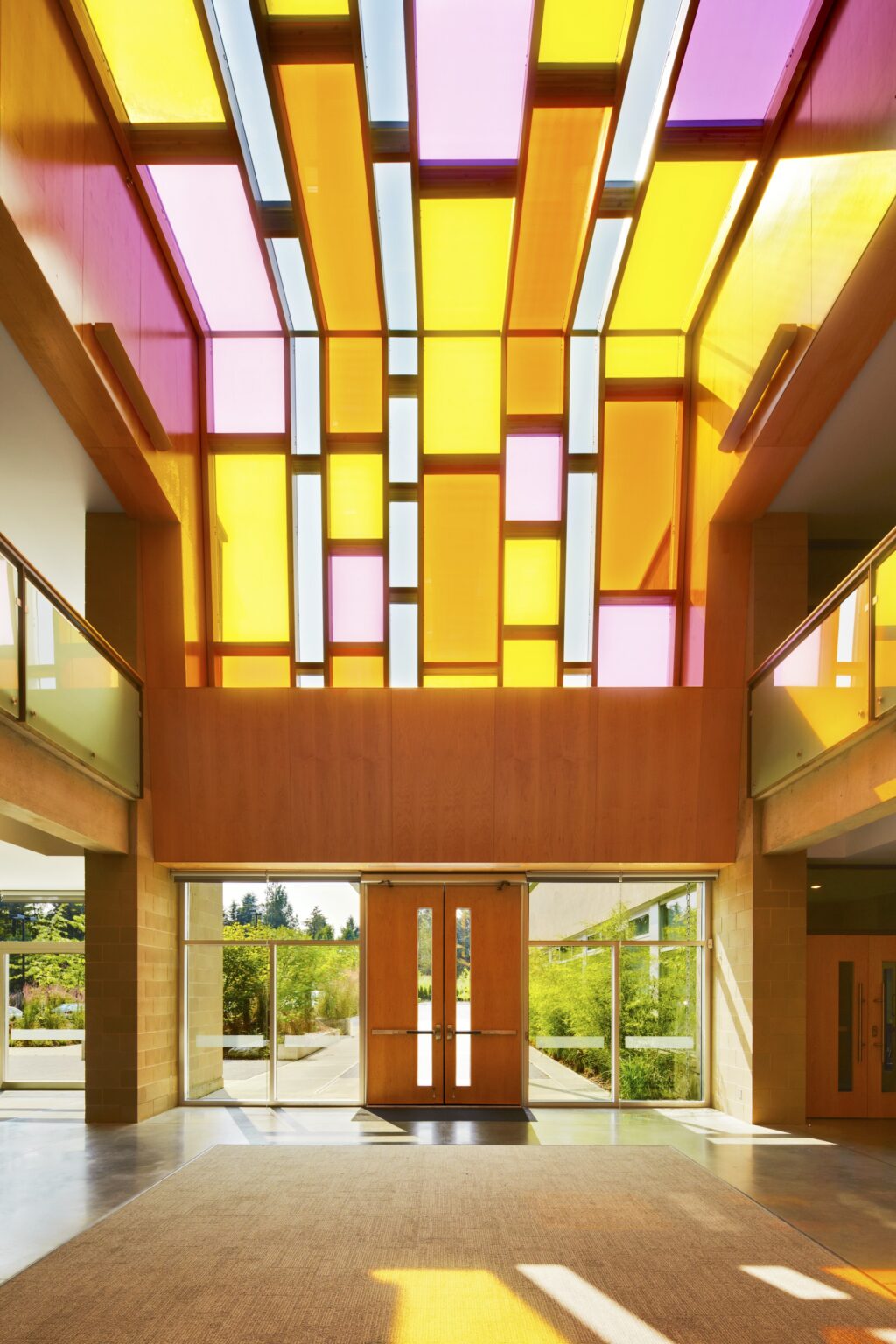 Christ Worship Centre lobby lit by colourful stained glass ceiling.