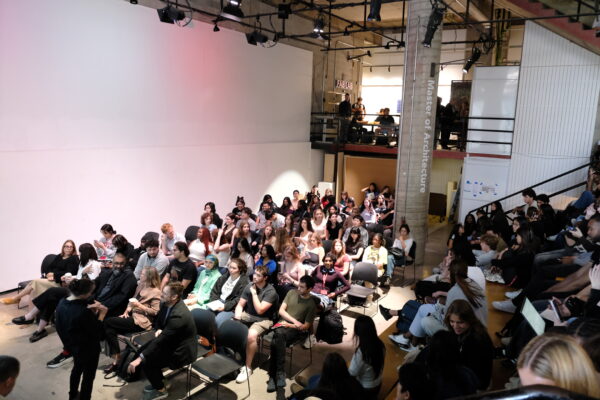 students, faculty and staff sitting in the pit